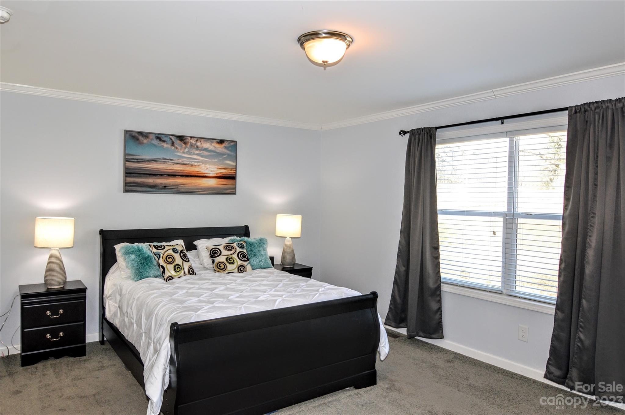 5717 Griffith Road Monroe, NC 28112 - Photo 22 of 48 a bedroom with a bed and a window