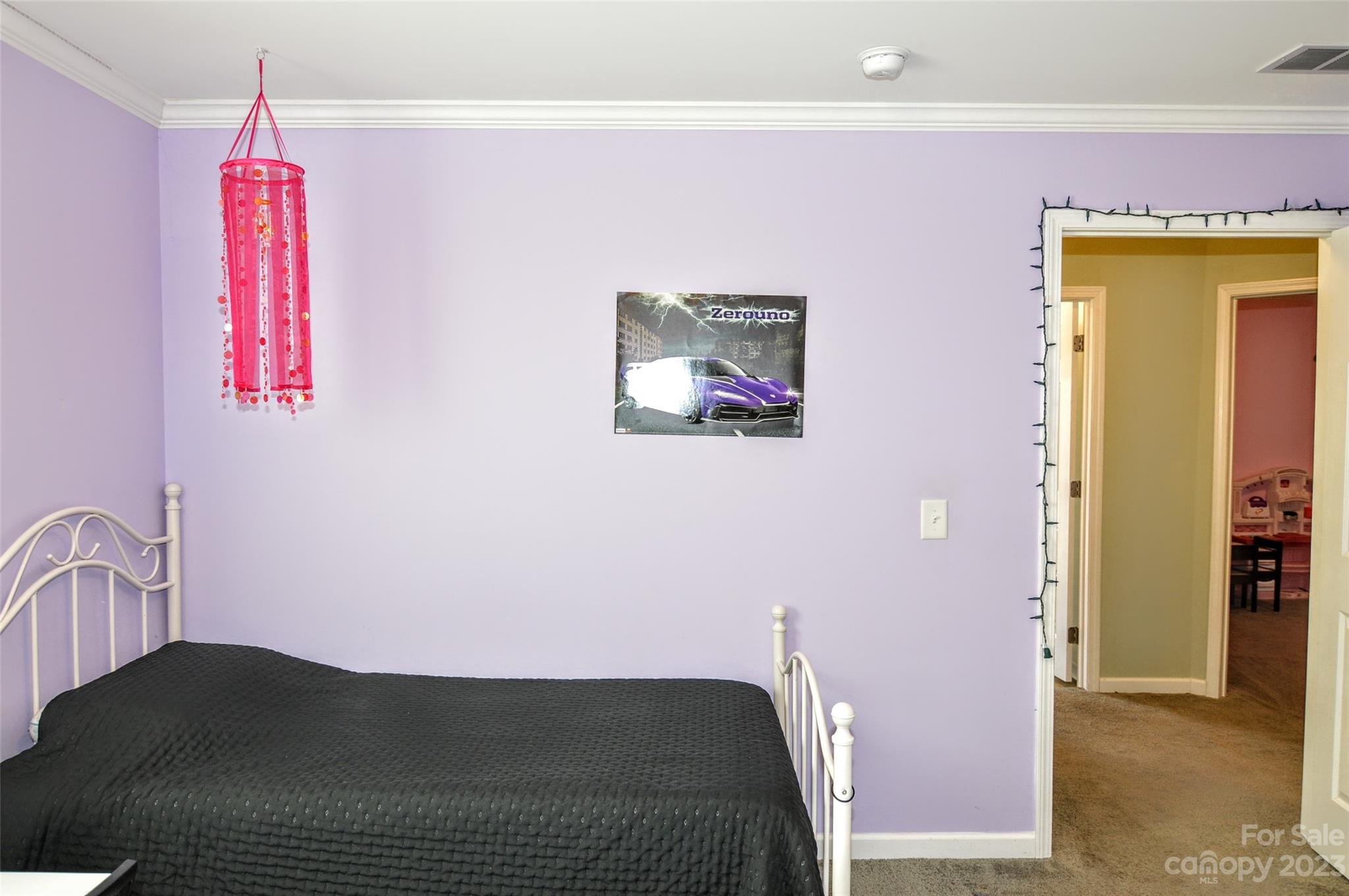 5717 Griffith Road Monroe, NC 28112 - Photo 31 of 48 a bedroom with a bed and a painting on the wall