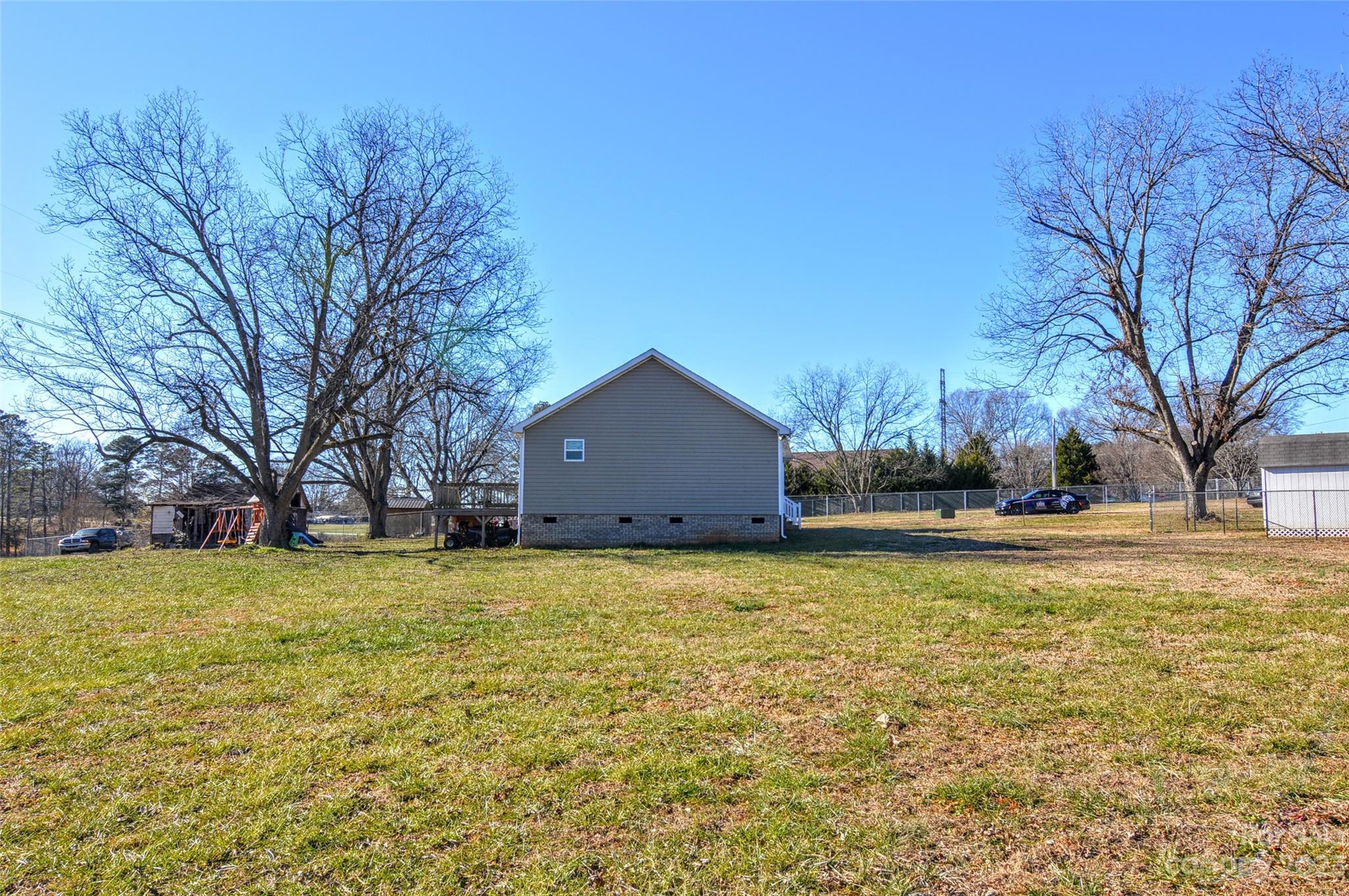 5717 Griffith Road Monroe, NC 28112 - Photo 38 of 48 a house with a large tree in front of it