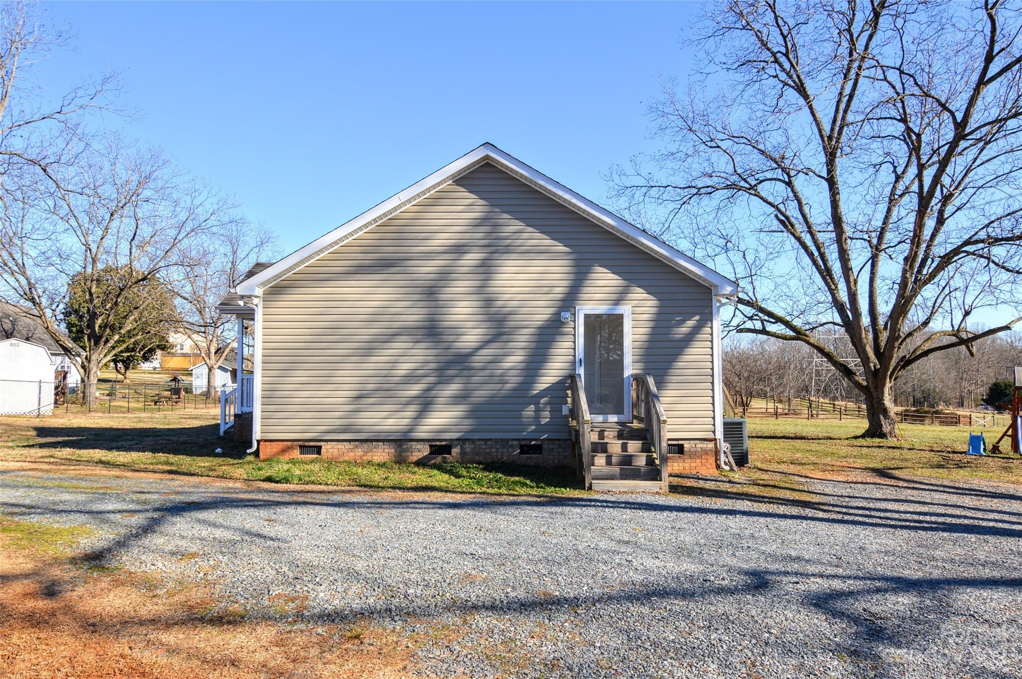 5717 Griffith Road Monroe, NC 28112 - Photo 39 of 48 a view of a house with snow on the road