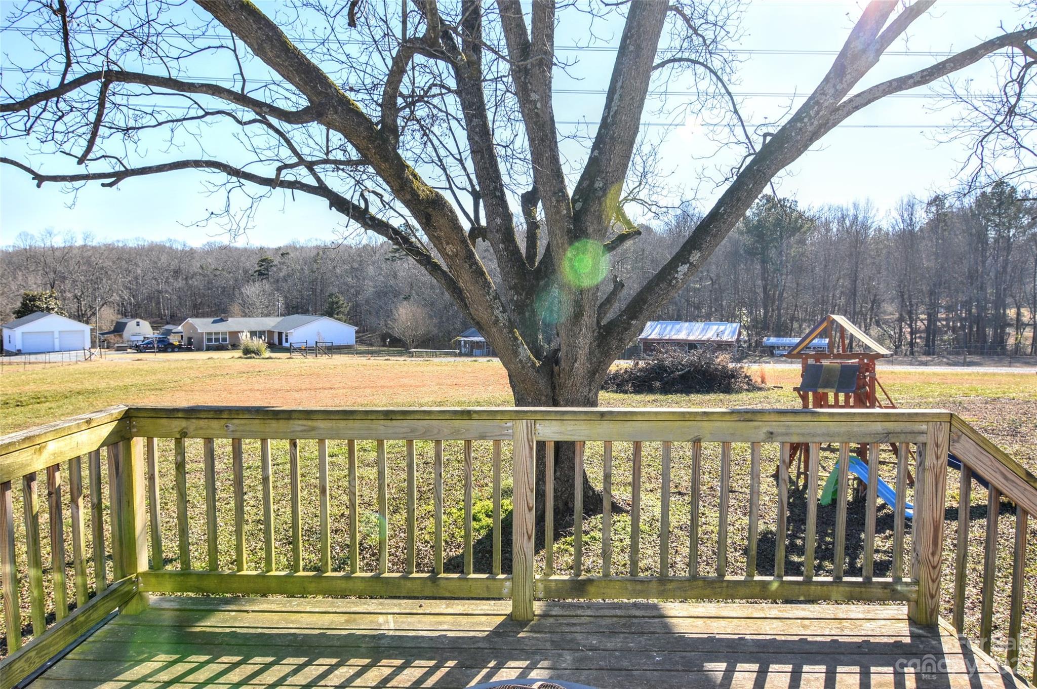 5717 Griffith Road Monroe, NC 28112 - Photo 44 of 48 a view of a large body of water with a large tree