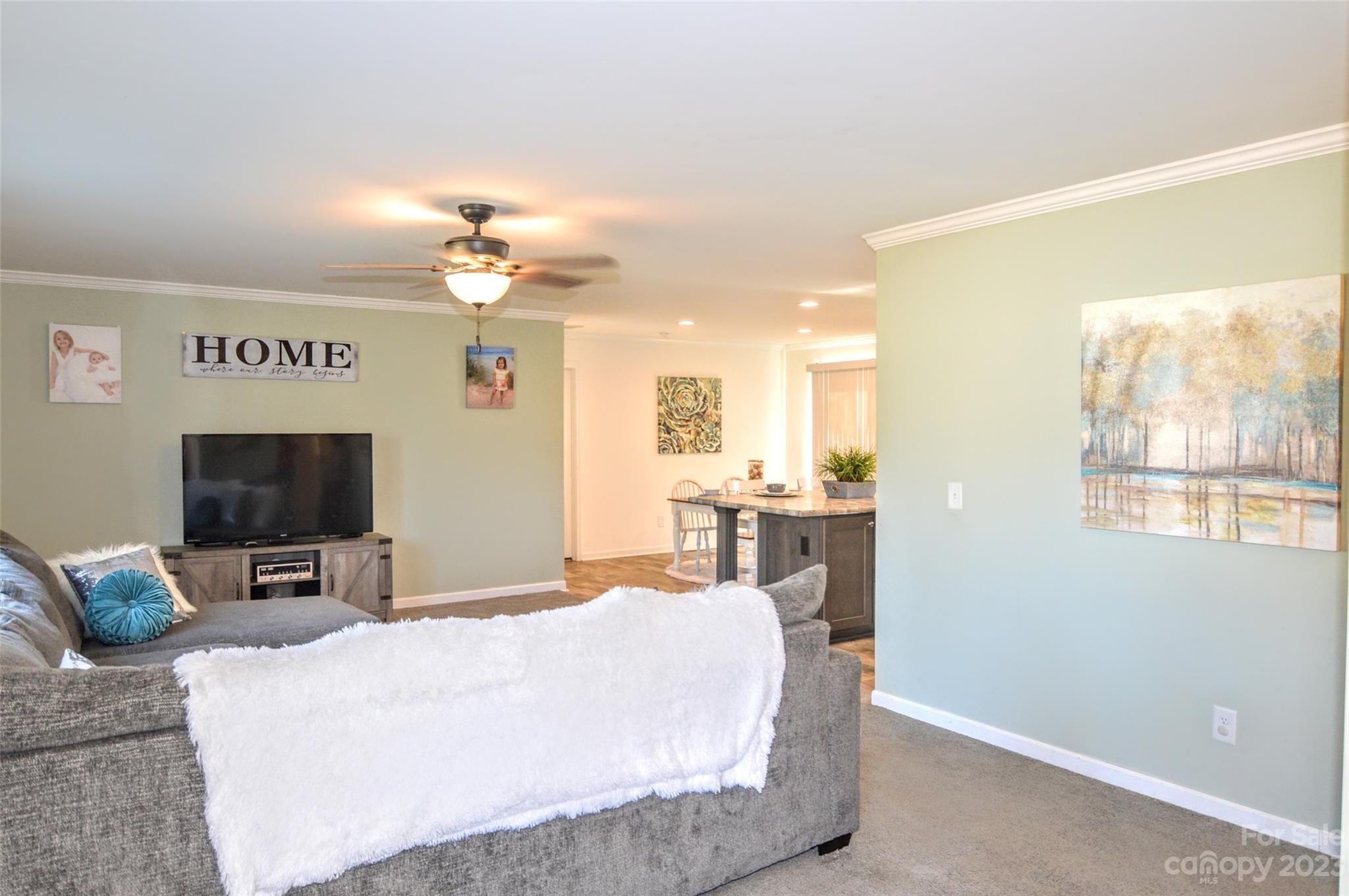 5717 Griffith Road Monroe, NC 28112 - Photo 5 of 48 a bedroom with a bed and a flat screen tv