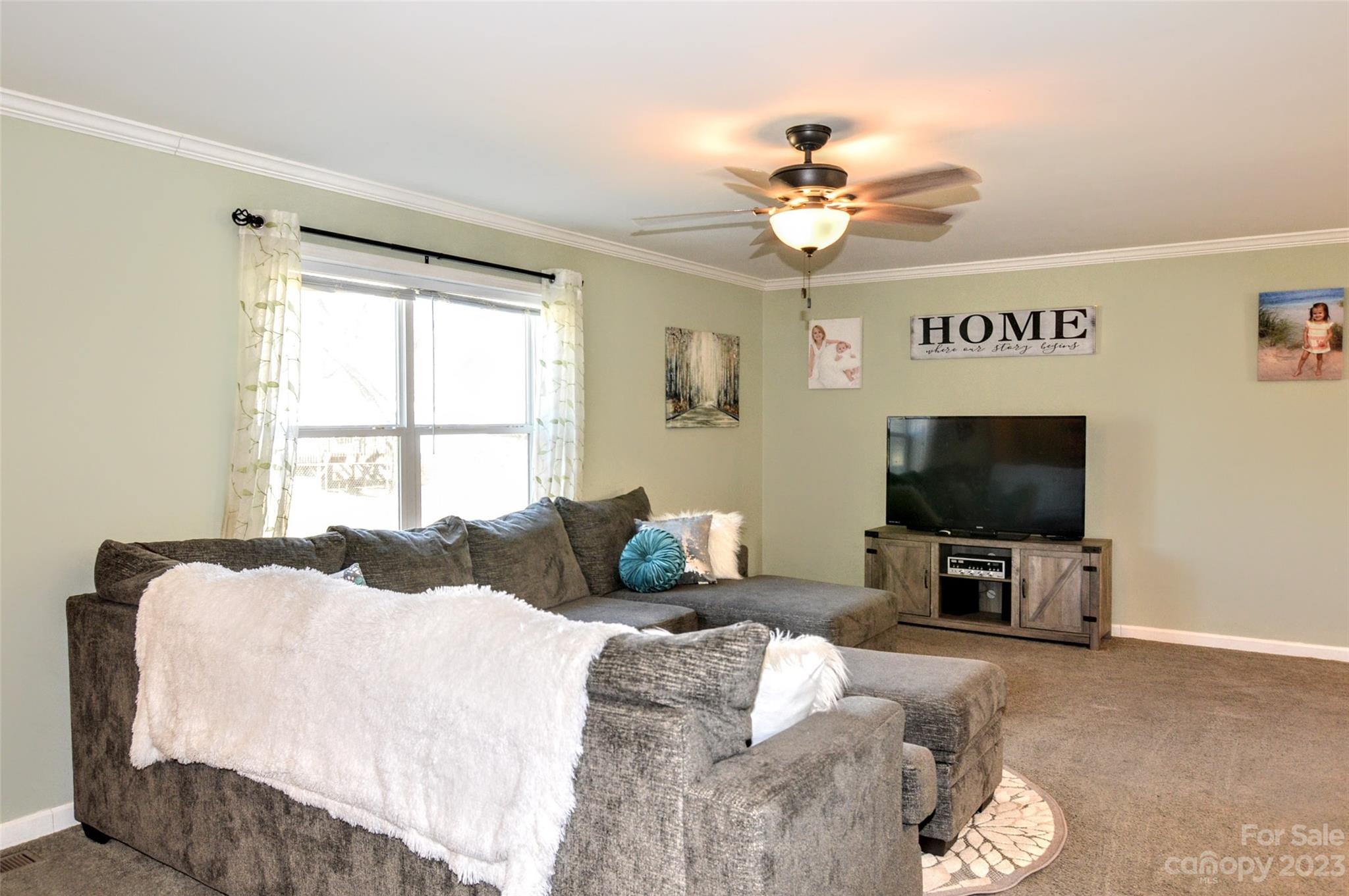5717 Griffith Road Monroe, NC 28112 - Photo 6 of 48 a bedroom with a bed and a flat screen tv