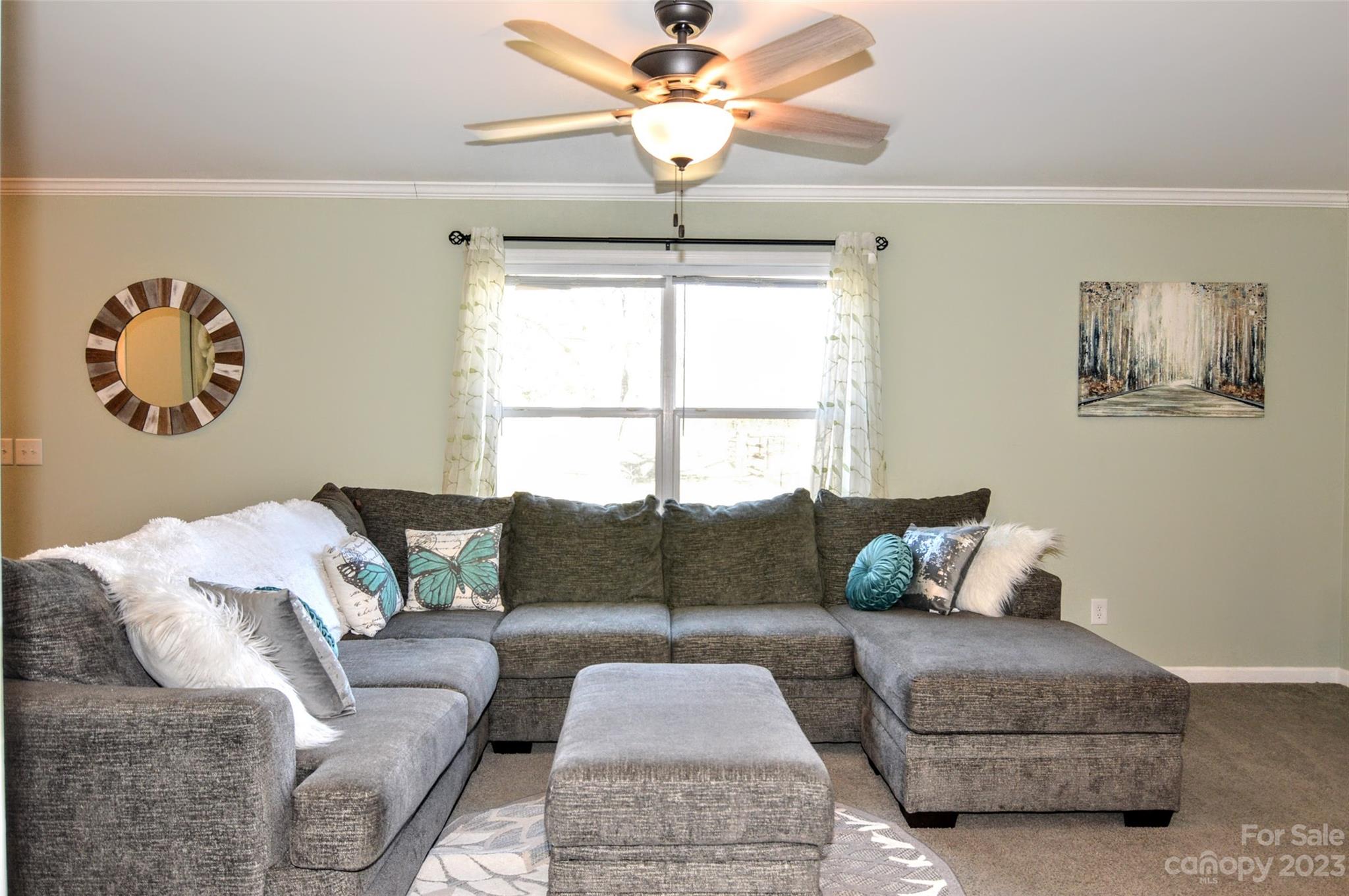 5717 Griffith Road Monroe, NC 28112 - Photo 7 of 48 a living room with furniture and a window