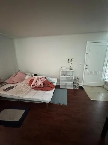 a bedroom with a bed and a table in it