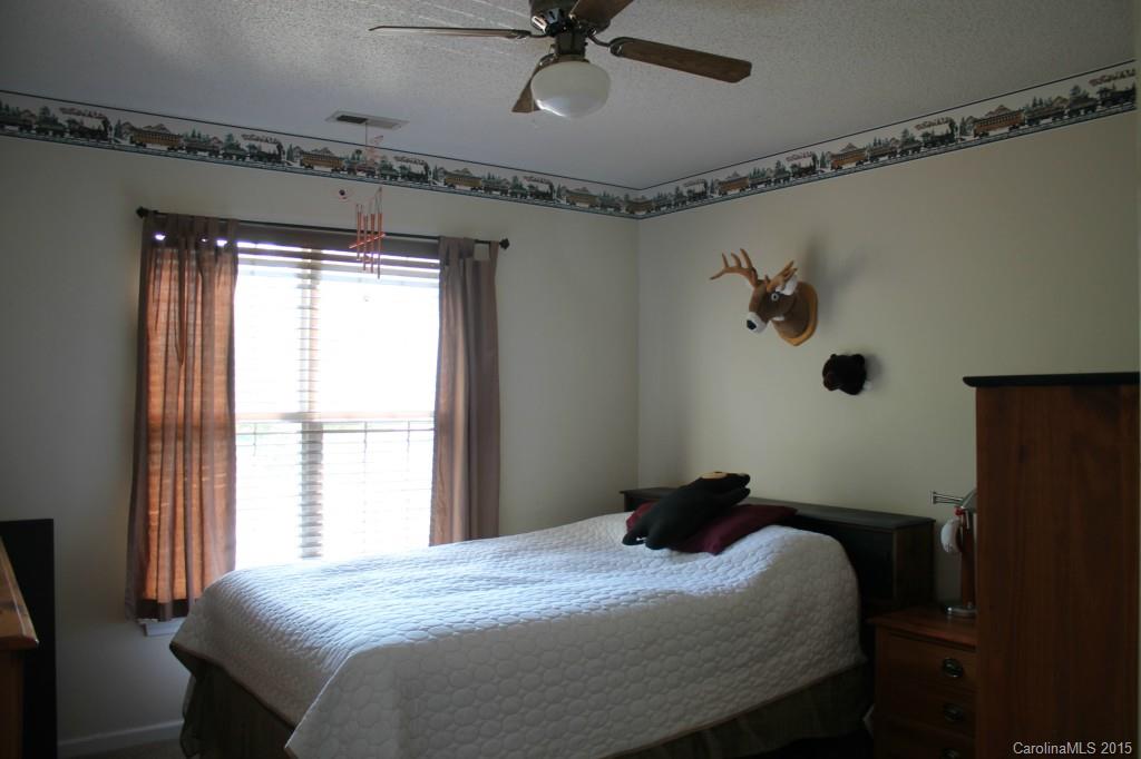 558 South Portman Lane Fort Mill, SC 29708 - Photo 14 of 23 a bedroom with a bed and a window