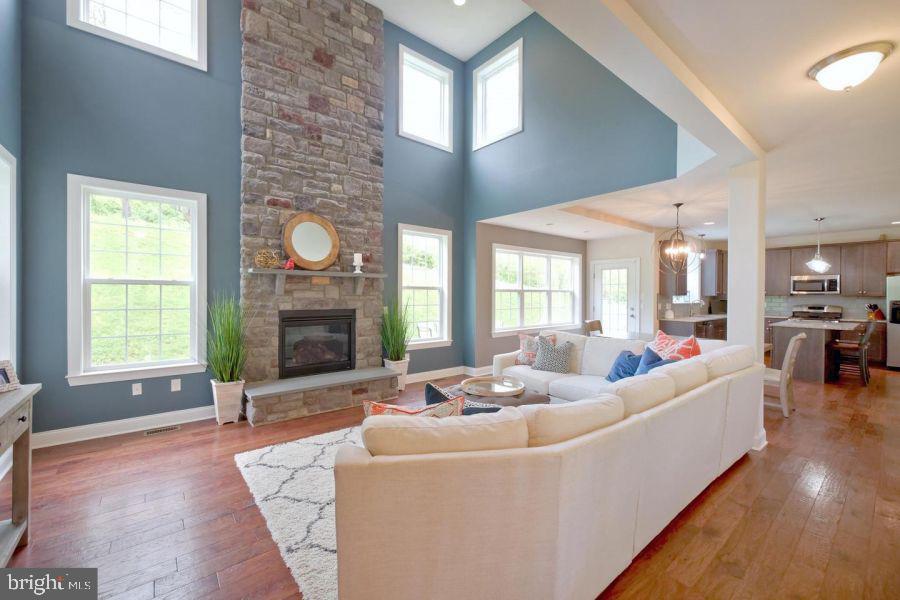 2617 County Line Road Chalfont, PA 18914 - Photo 19 of 40 a living room with fireplace furniture and a large window