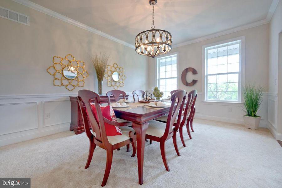 2617 County Line Road Chalfont, PA 18914 - Photo 22 of 40 a view of a dining room with furniture a chandelier and a window