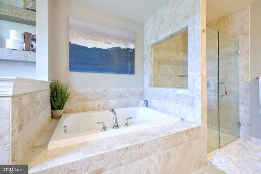 2617 County Line Road Chalfont, PA 18914 - Photo 25 of 40 a white bath tub sitting next to a window