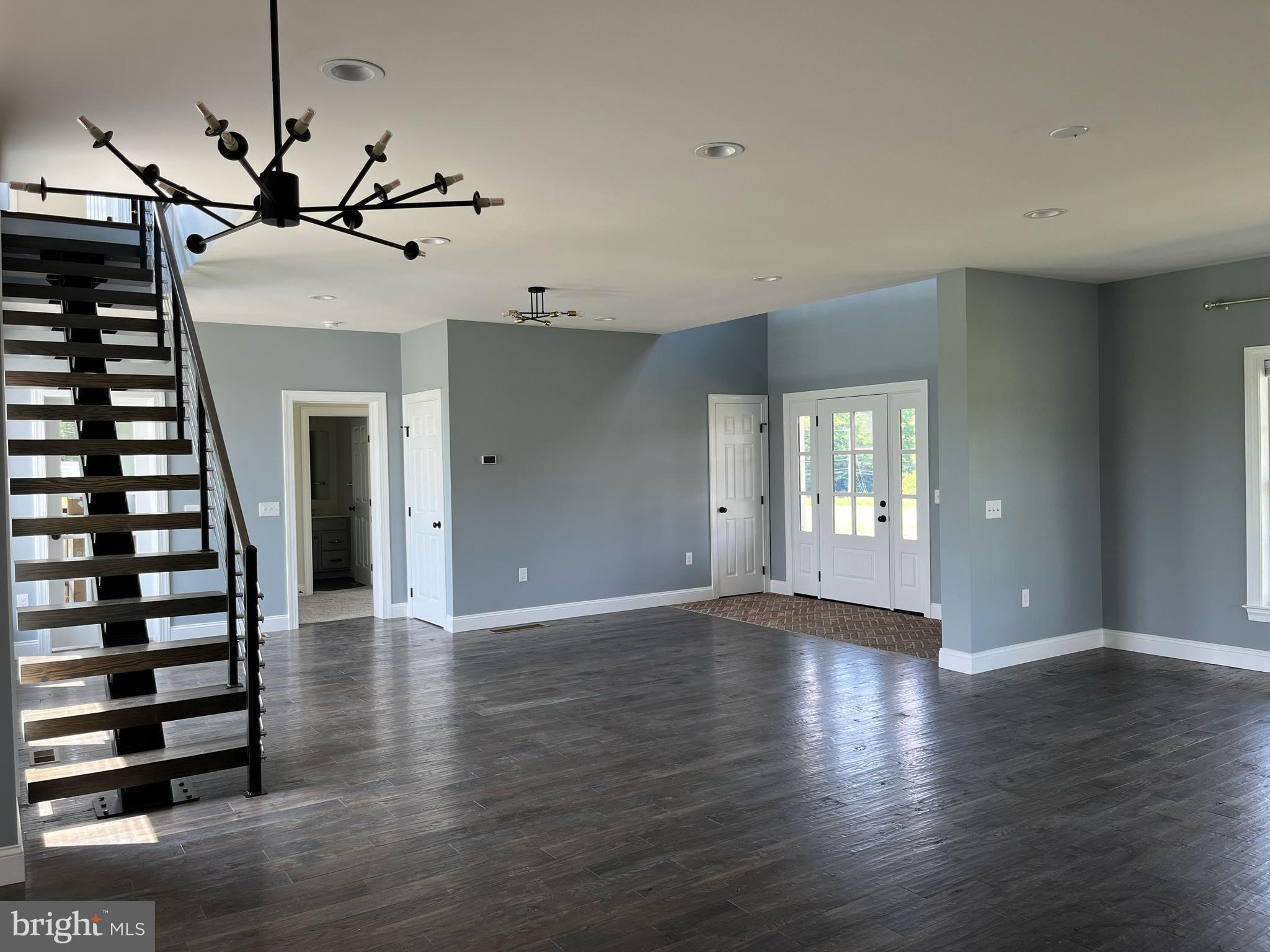 2617 County Line Road Chalfont, PA 18914 - Photo 32 of 40 a view of an empty room with wooden floor fan and windows