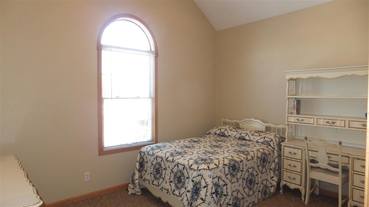 2835 Dourdan Road Belvidere, IL 61008 - Photo 14 of 25 a bedroom with a bed and a window