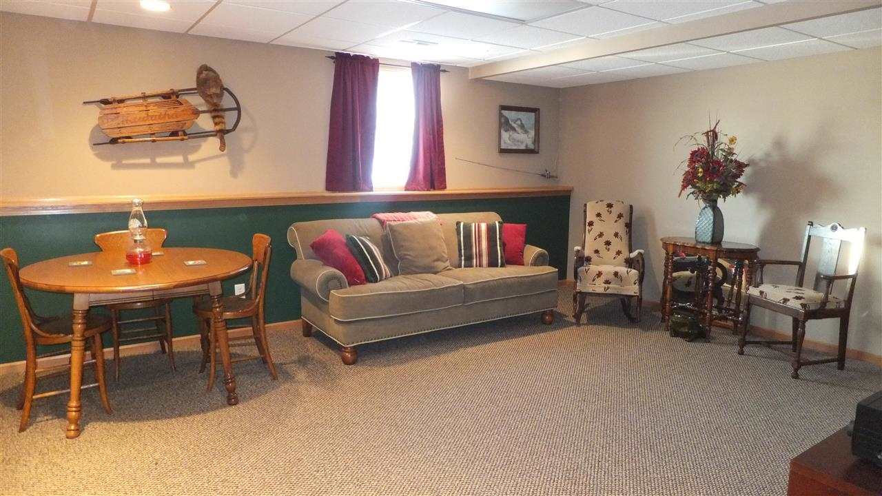 2835 Dourdan Road Belvidere, IL 61008 - Photo 19 of 25 a living room with furniture and a dining table