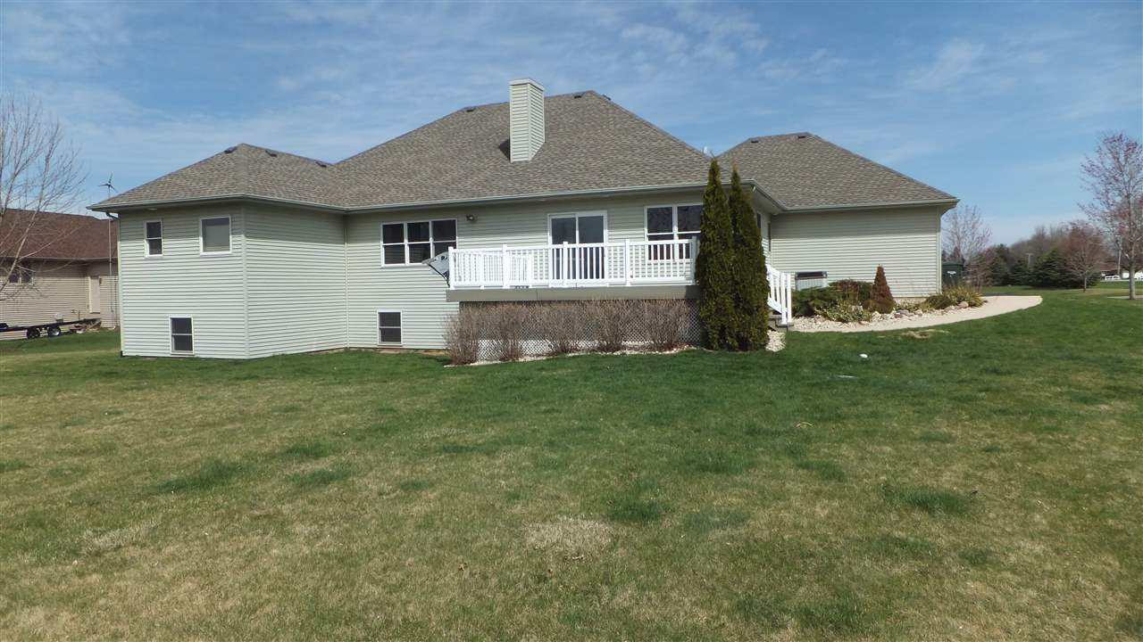 2835 Dourdan Road Belvidere, IL 61008 - Photo 25 of 25 a front view of a house with a garden and yard