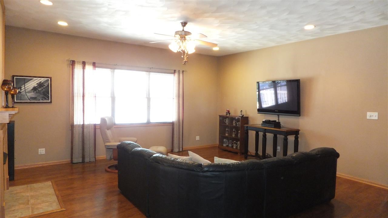 2835 Dourdan Road Belvidere, IL 61008 - Photo 3 of 25 a living room with furniture and a flat screen tv