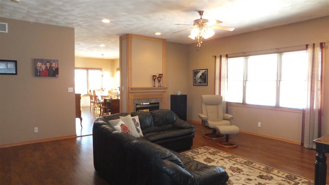 2835 Dourdan Road Belvidere, IL 61008 - Photo 4 of 25 a living room with furniture and a chandelier