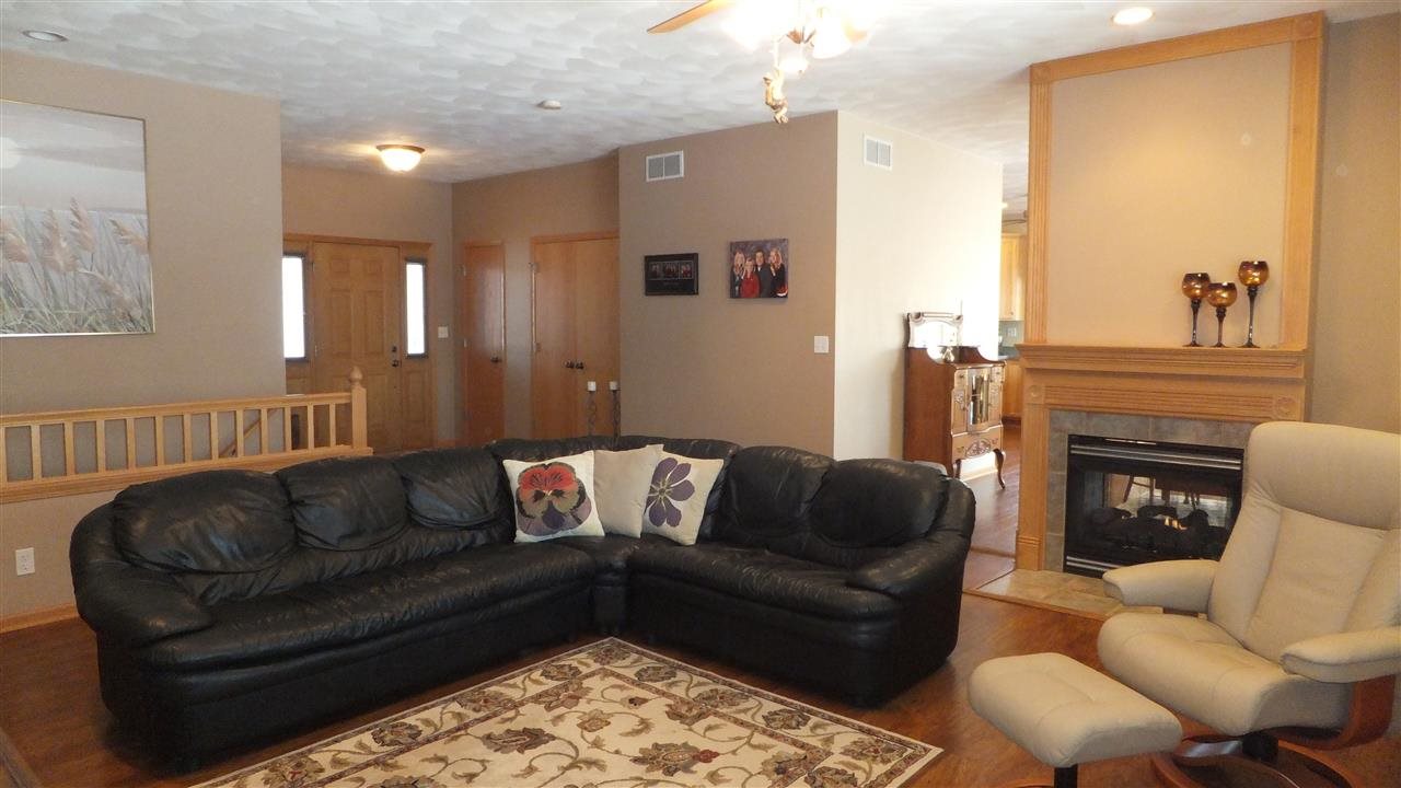 2835 Dourdan Road Belvidere, IL 61008 - Photo 5 of 25 a living room with furniture and a fireplace