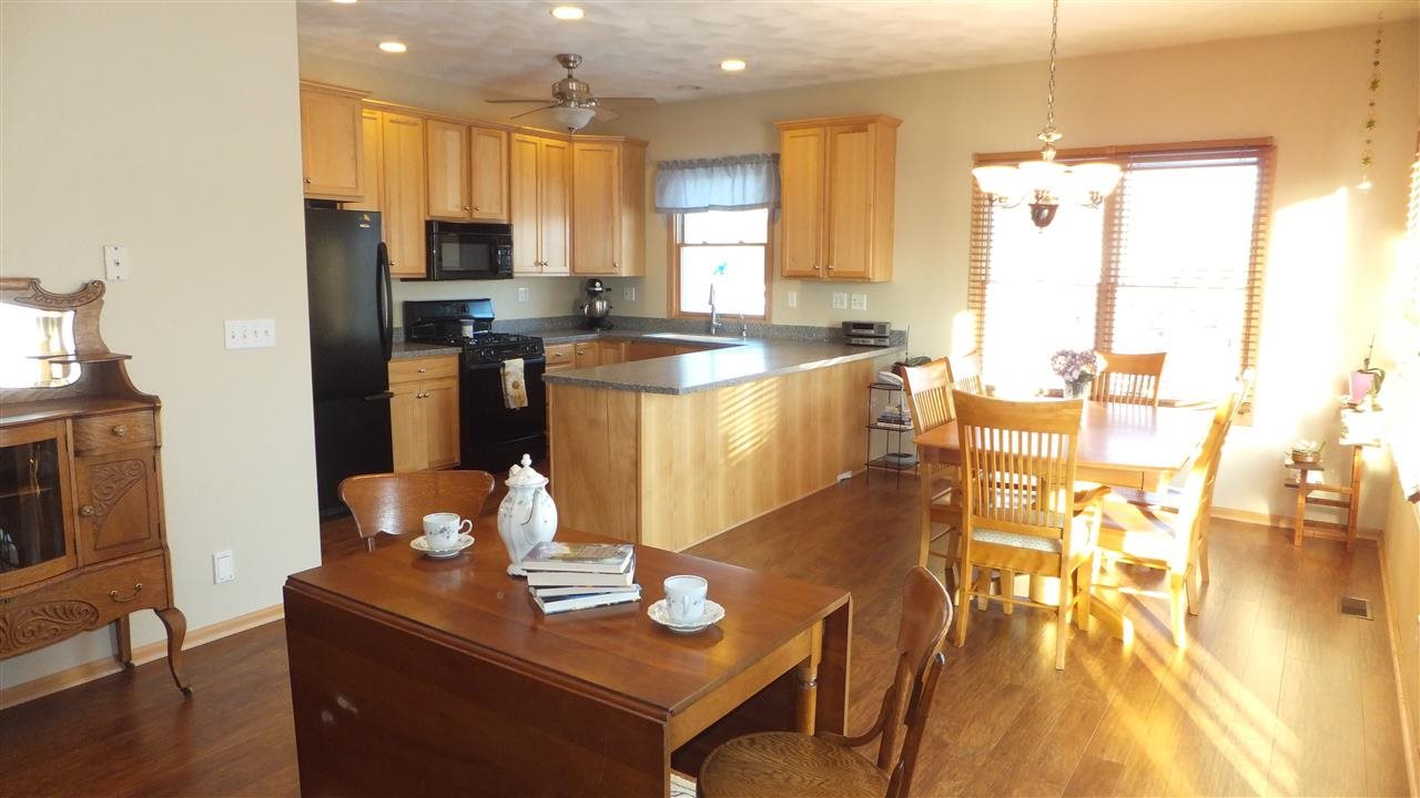 2835 Dourdan Road Belvidere, IL 61008 - Photo 6 of 25 a large kitchen with lots of counter space and windows