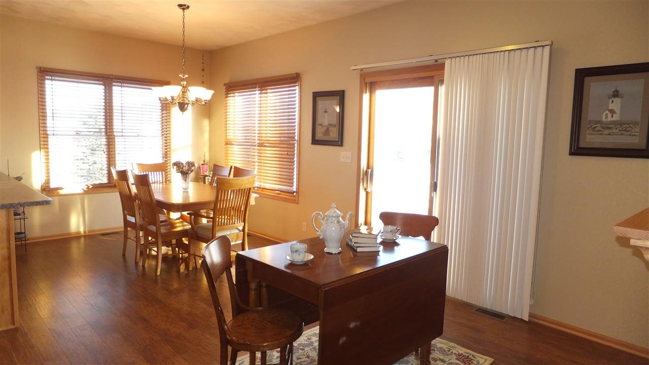 2835 Dourdan Road Belvidere, IL 61008 - Photo 8 of 25 a view of a dining room with furniture window and wooden floor