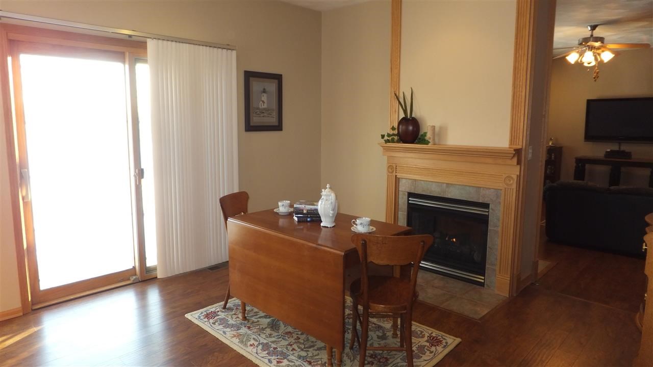 2835 Dourdan Road Belvidere, IL 61008 - Photo 10 of 25 a living room with furniture and a fireplace