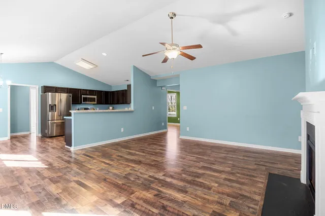 a view of a kitchen with a stove cabinets and wooden floor