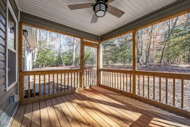 a view of porch with wooden floor