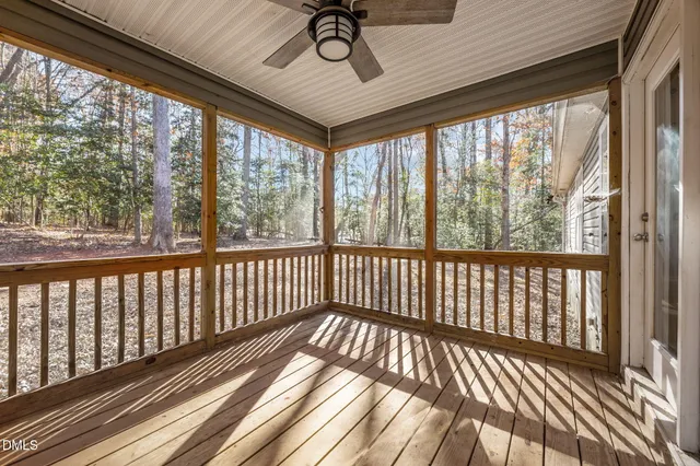 a view of two chairs in the balcony