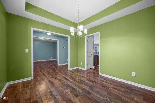 a view of a room with window and wooden floor
