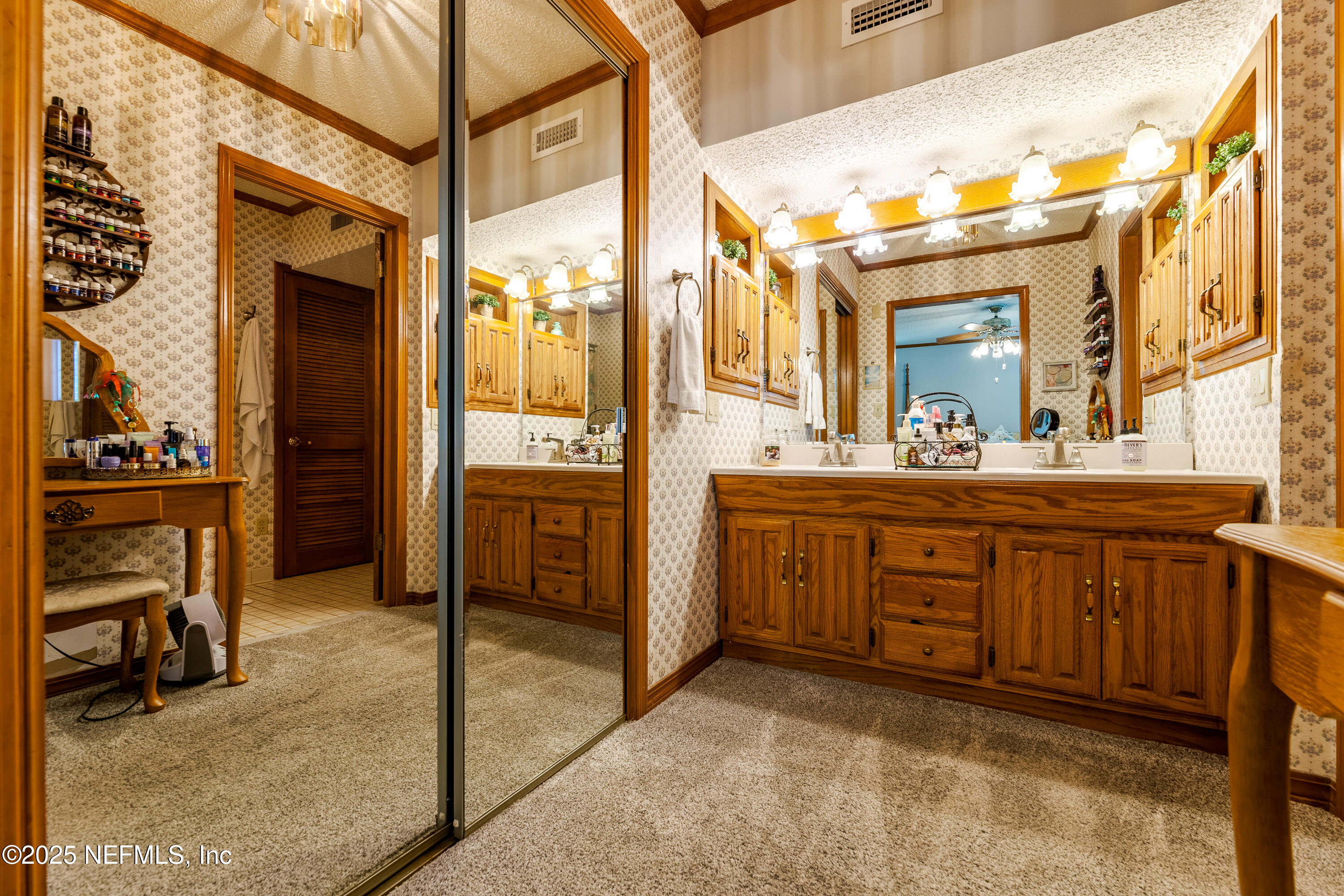 6542 Ovington Road South Jacksonville, FL 32216 - Photo 24 of 35 a bathroom with a sink a vanity and a mirror