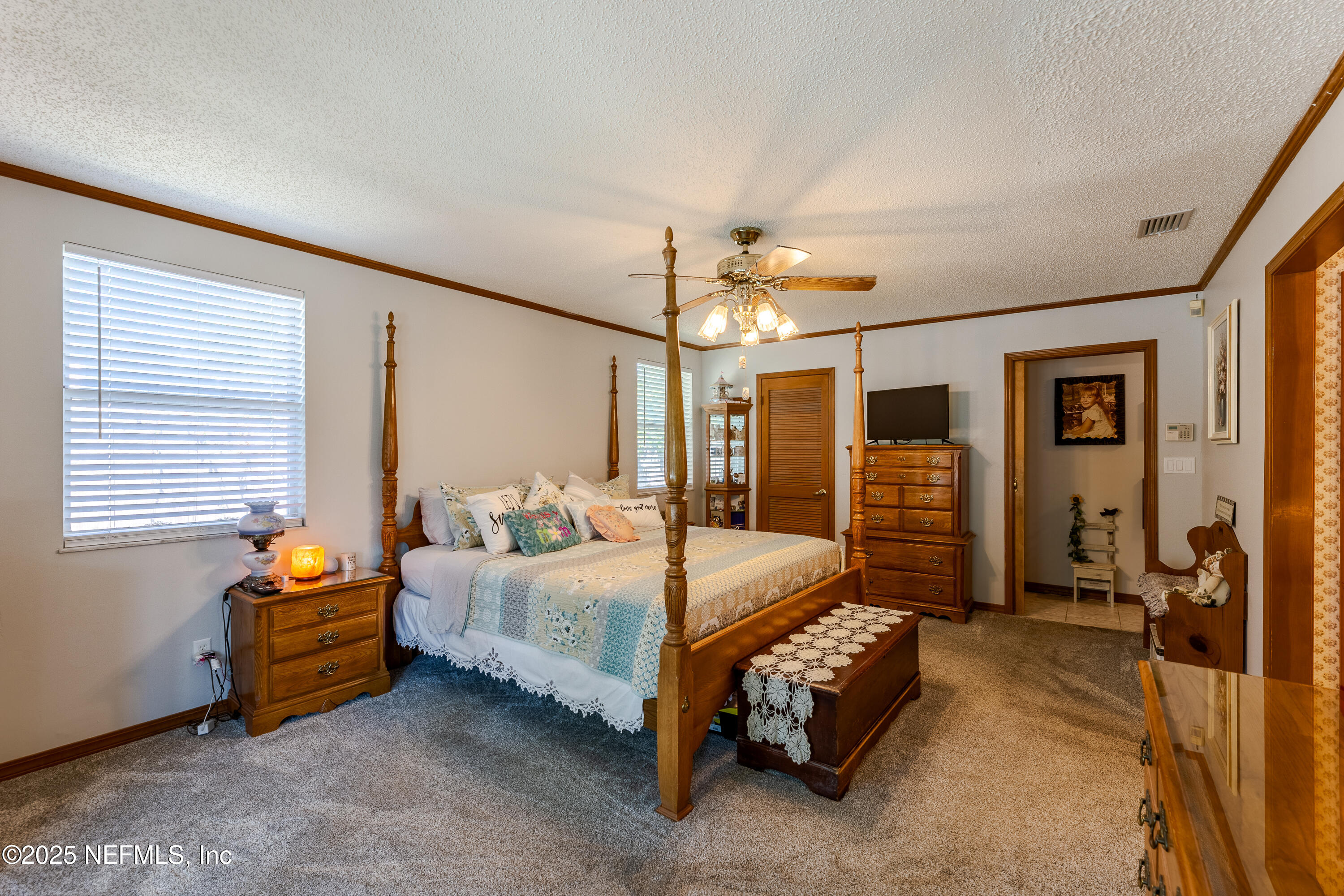 6542 Ovington Road South Jacksonville, FL 32216 - Photo 26 of 35 a bedroom with bed and window