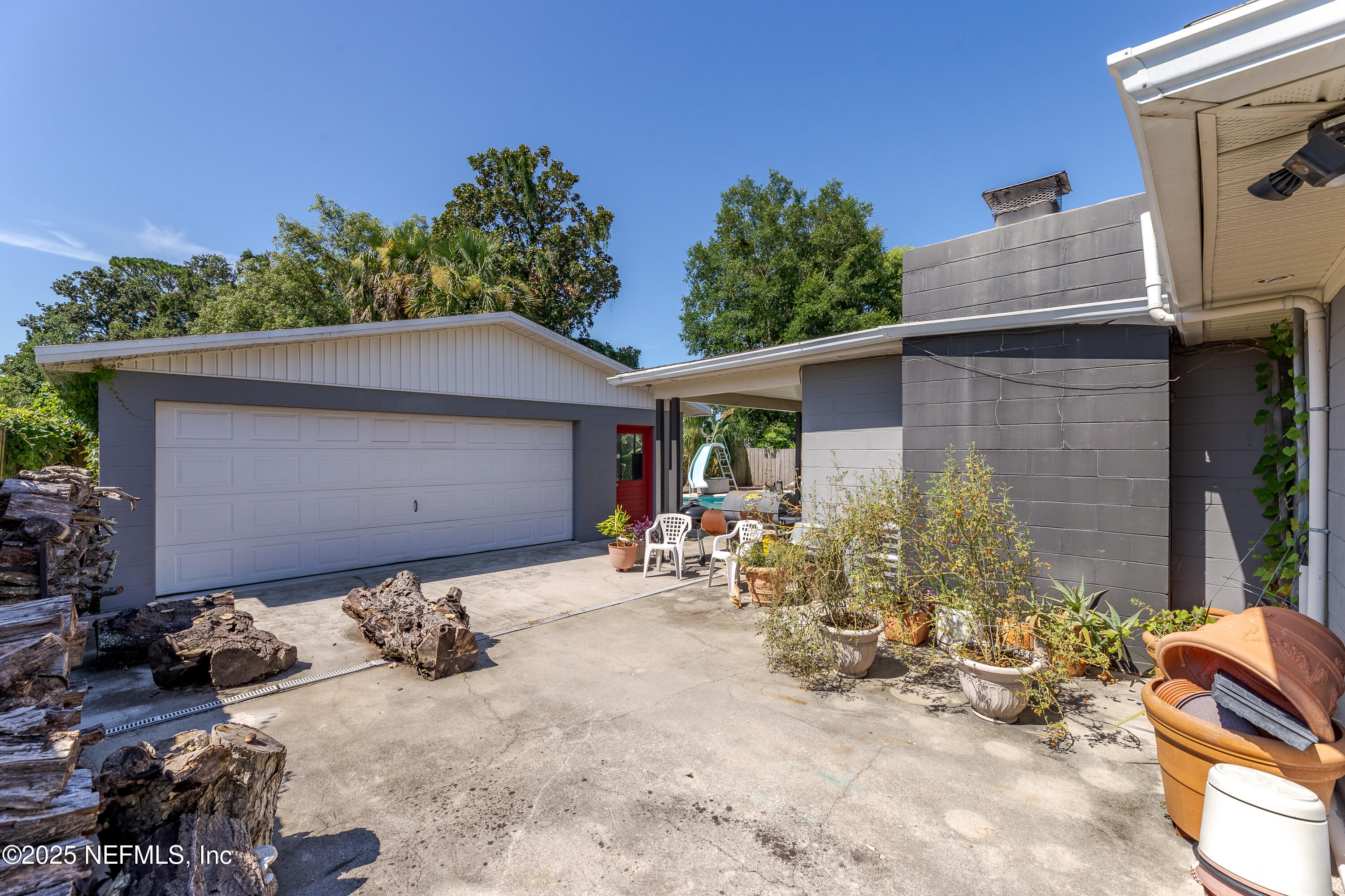6542 Ovington Road South Jacksonville, FL 32216 - Photo 6 of 35 a backyard of a house with yard and outdoor seating