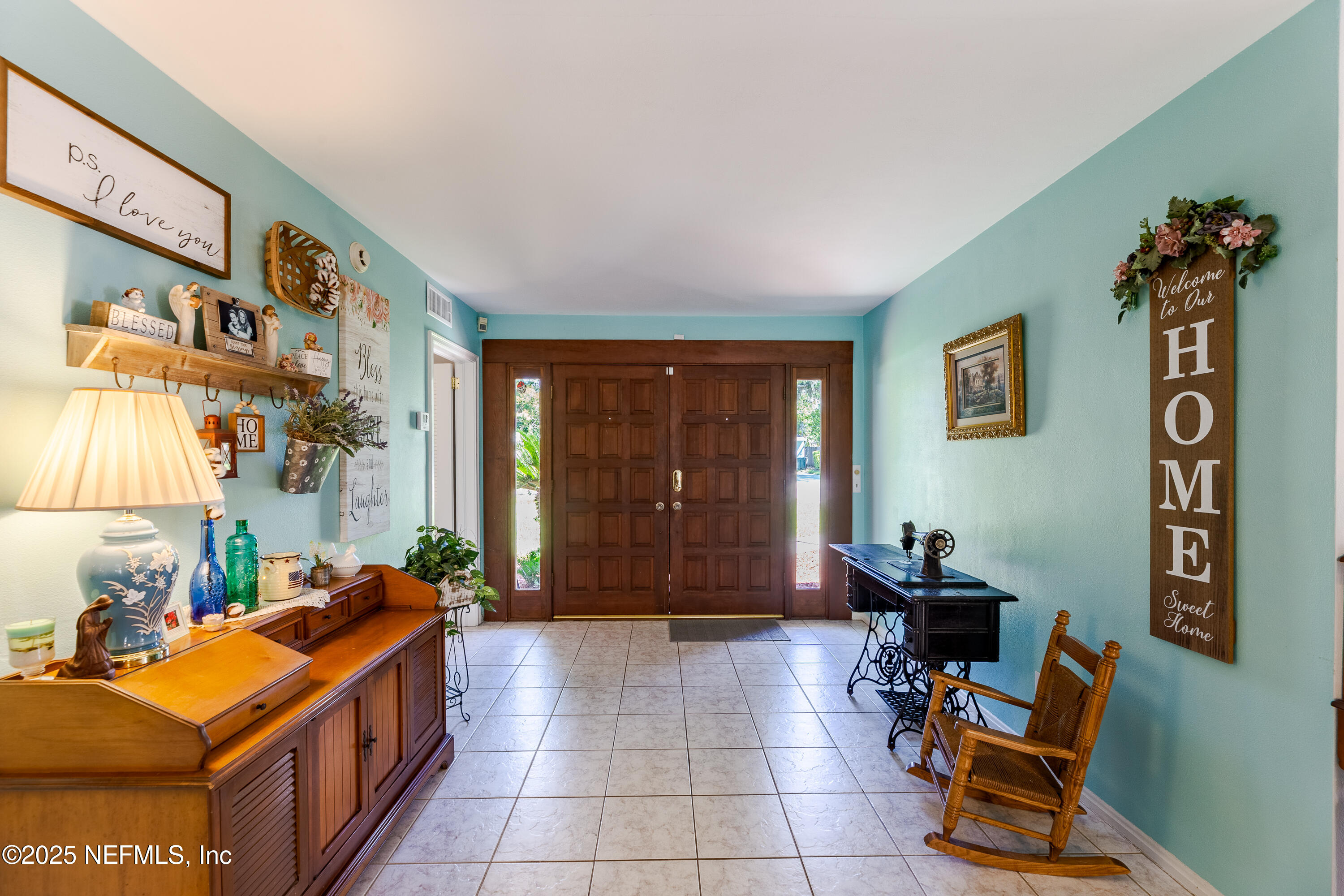 6542 Ovington Road South Jacksonville, FL 32216 - Photo 7 of 35 a room with furniture a window and potted plants
