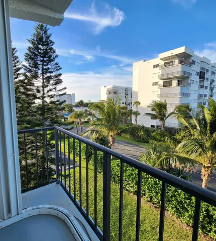 a view of a balcony with city view