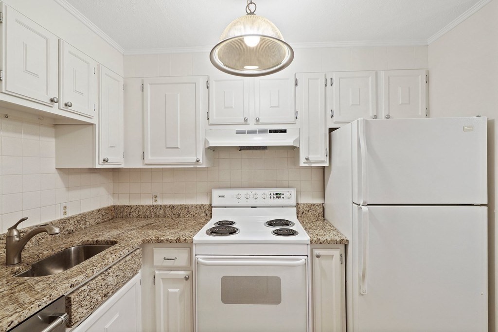 209 Great Road, Unit C3 Acton, MA 01720 - Photo 2 of 17 a kitchen with a stove a refrigerator and a sink
