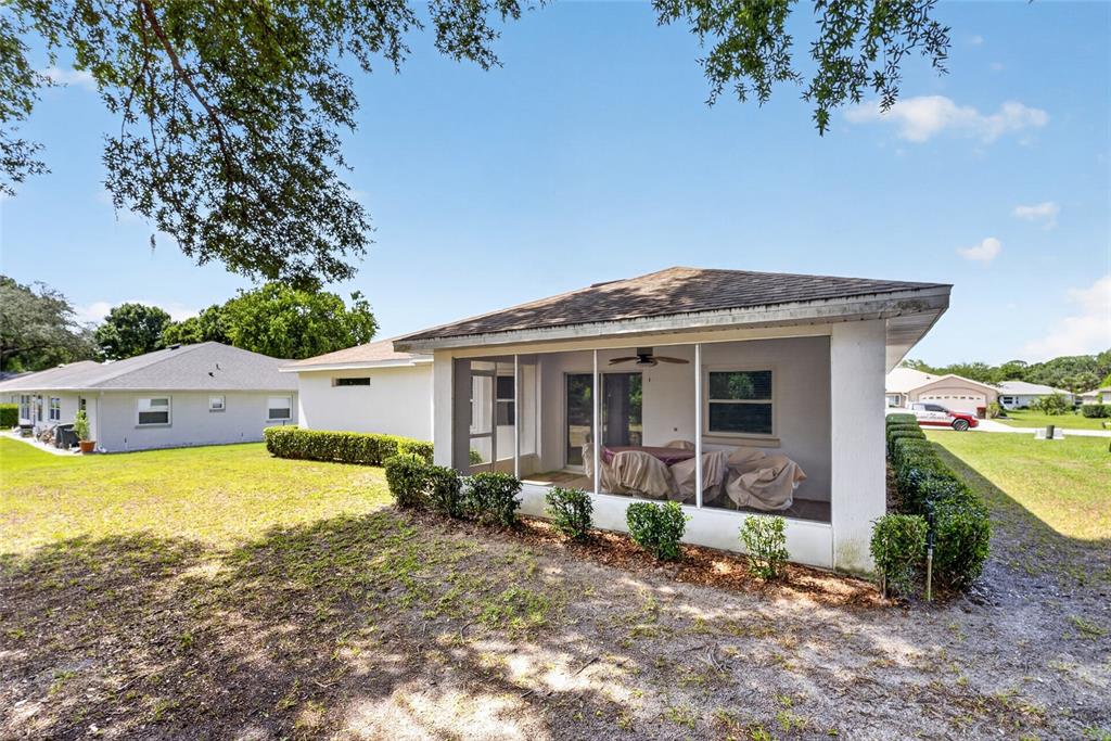 6032 Southwest 103rd Loop Ocala, FL 34476 - Photo 22 of 28 a front view of a house with garden