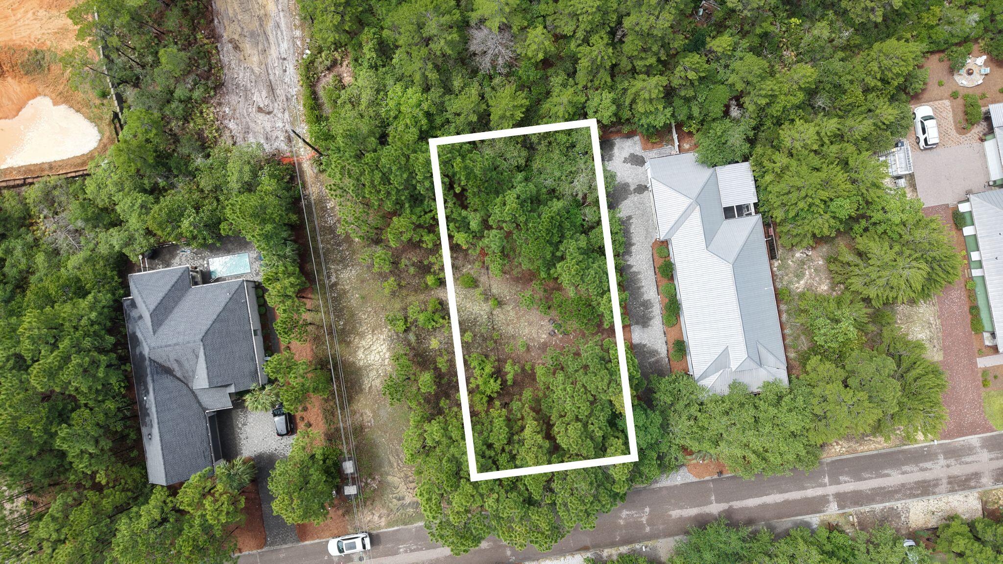 122 Spotted Dolphin Road Santa Rosa Beach, FL 32459 - Photo 1 of 11 an aerial view of residential house with outdoor space and trees all around