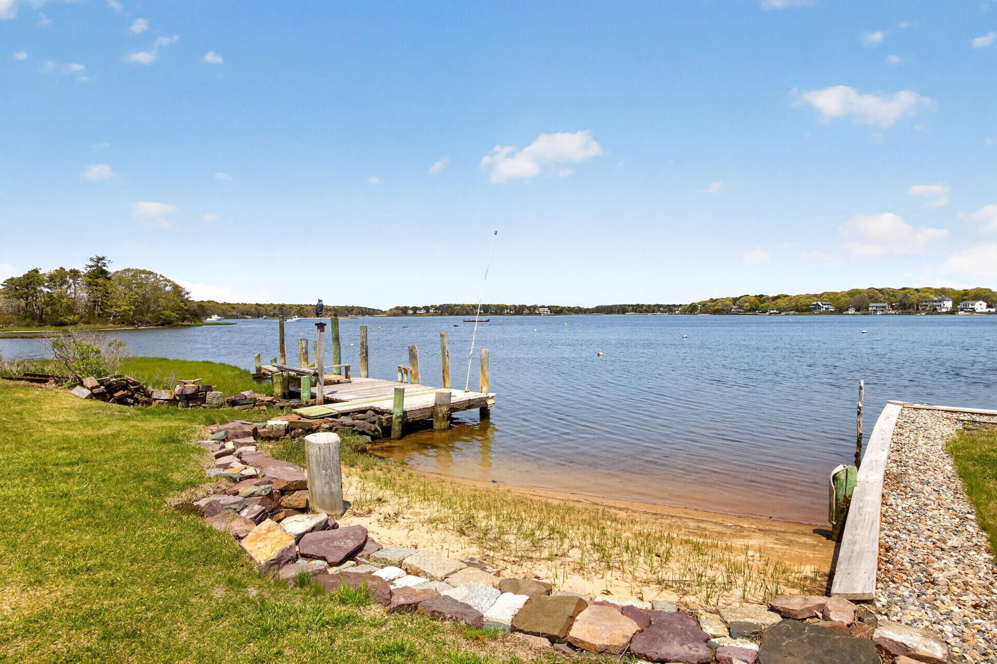 11 Clamshell Lane Mashpee, MA 02649 - Photo 31 of 43 a view of a lake with houses in the back