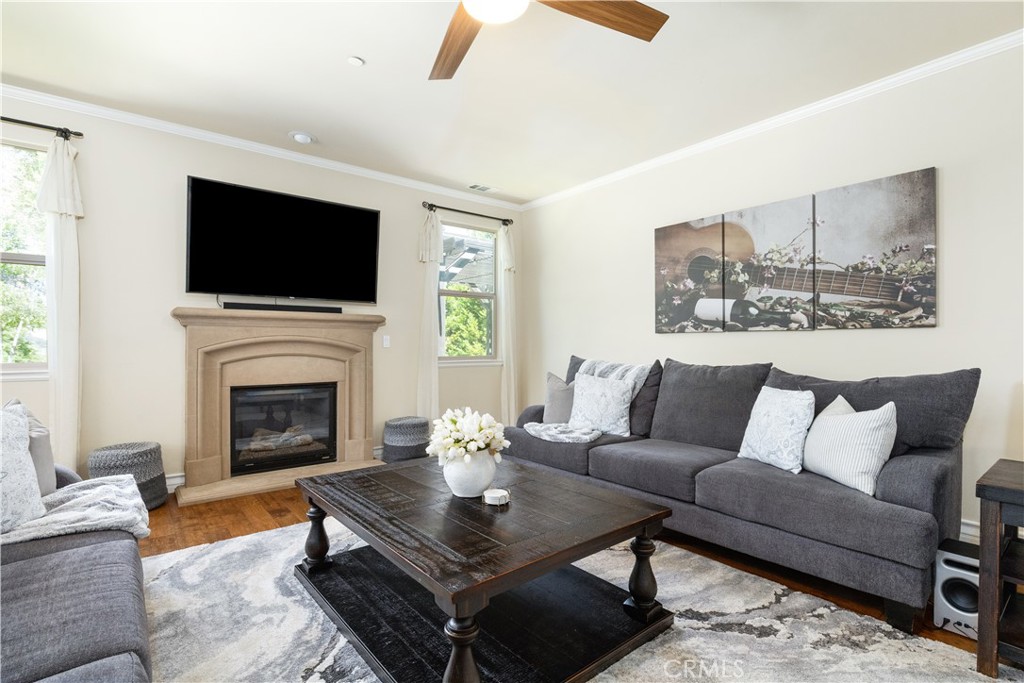 669 Red Cloud Road Paso Robles, CA 93446 - Photo 8 of 61 a living room with furniture a fireplace and a flat screen tv