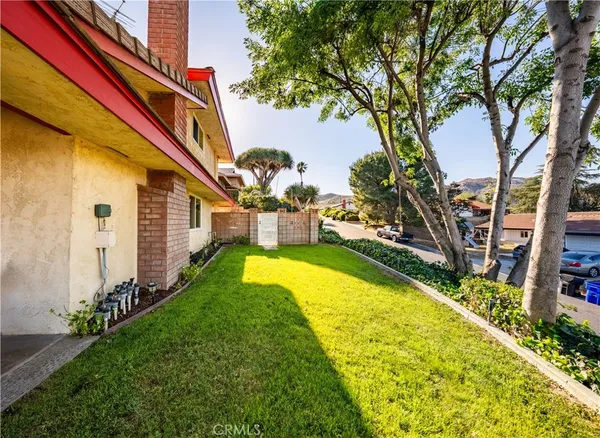 a view of swimming pool with outdoor seating and yard
