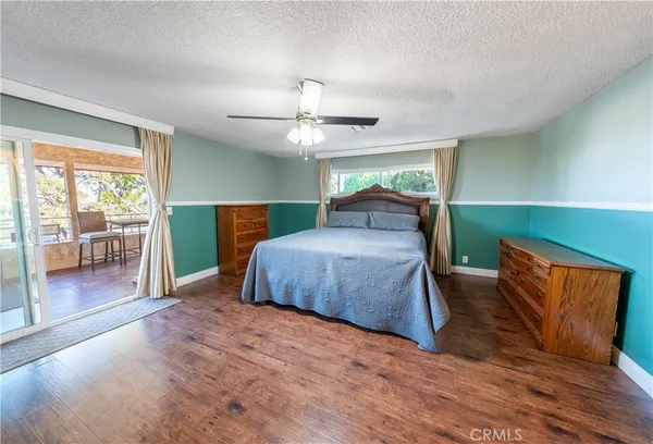 a bedroom with furniture and a chandelier