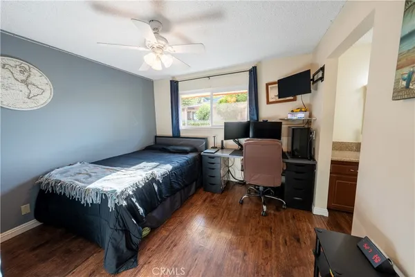 a bedroom with furniture and a window