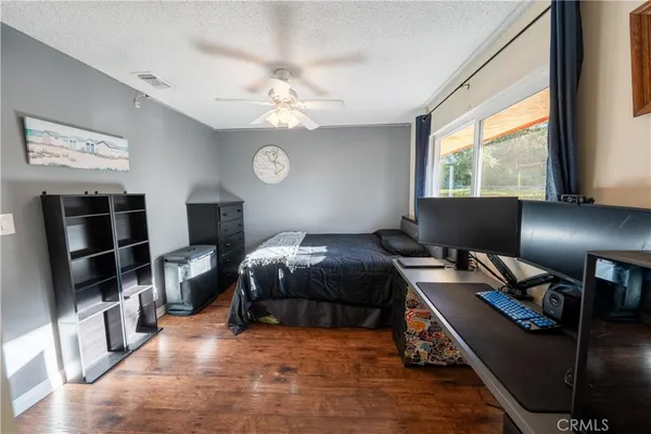 a bedroom with furniture and a window
