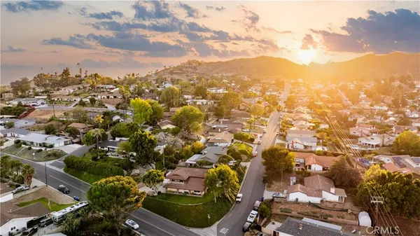 an aerial view of residential building and trees around