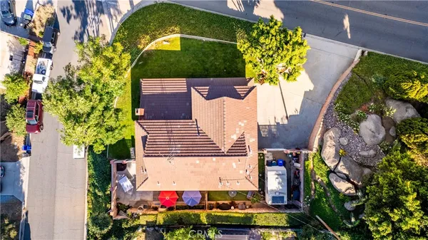 a view of a house with a yard and sitting area