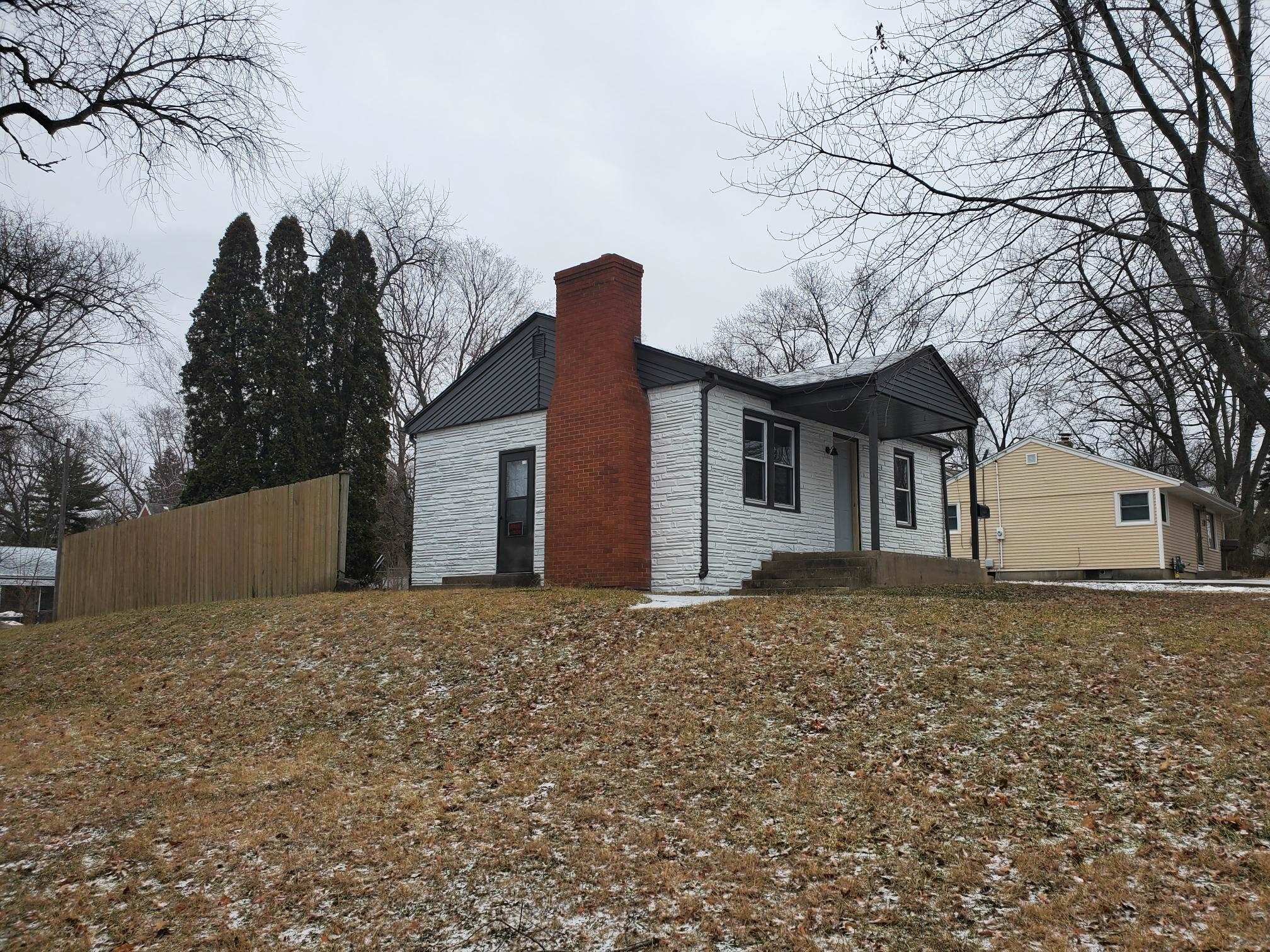 1804 Ridgeland Road Rockford, IL 61108 - Photo 3 of 22 a front view of a house with a yard and garage