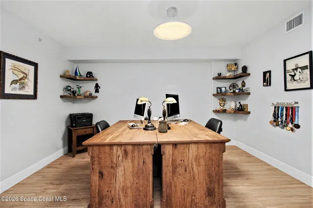 a view of a workspace with furniture