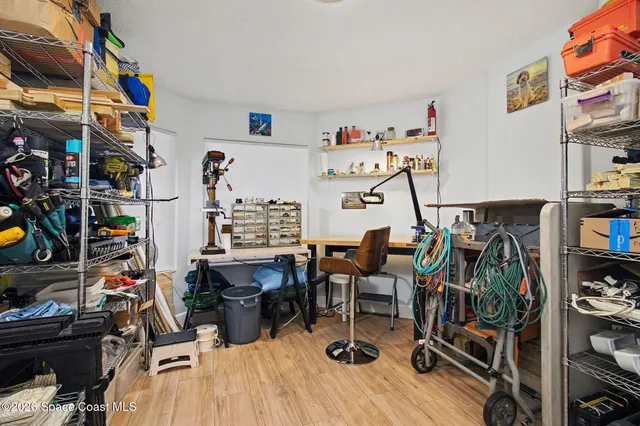 a view of a workspace with furniture and toys