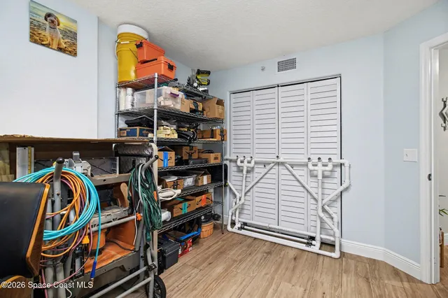 a view of an empty room with shelves