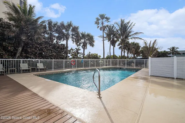 a view of a swimming pool with a lake view