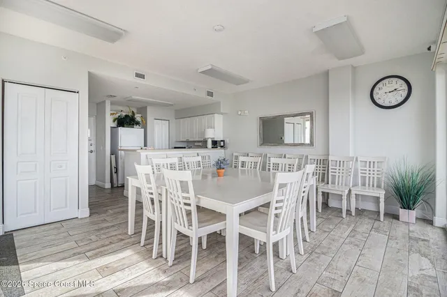 a view of a dining room with furniture and window