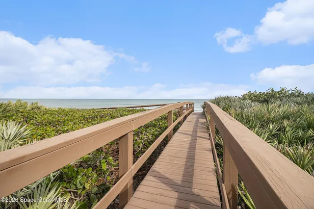 a view of city and mountain from a balcony
